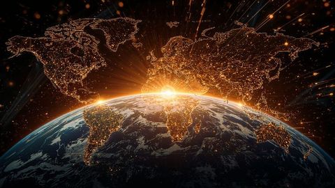 Golden Sunrise Over Earth with Illuminated Map and City Lights
