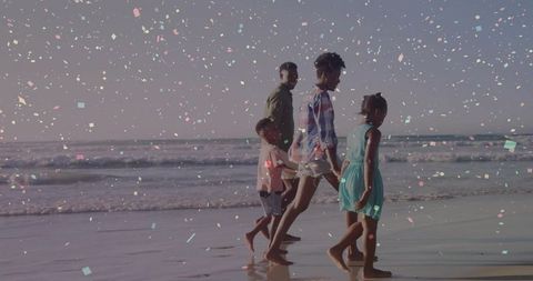 Family Enjoying Serene Walk Along Sunny Ocean Shoreline