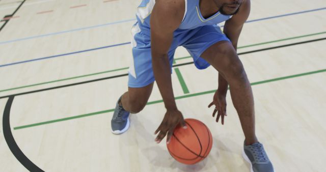 Focused Basketball Player Dribbling on Indoor Court - Download Free Stock Images Pikwizard.com