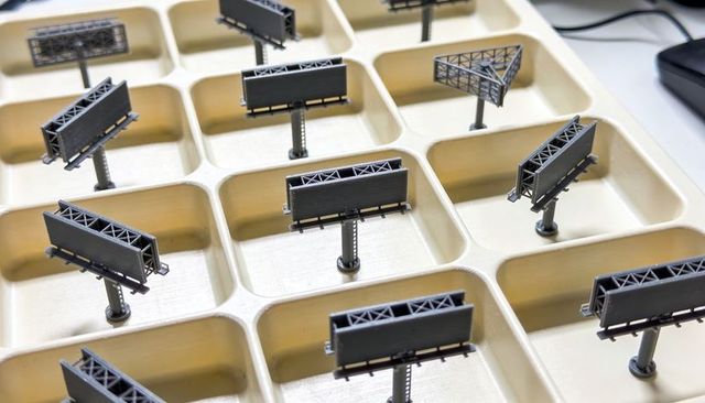 Miniature billboard models in organizer tray for scale signage prototyping and display