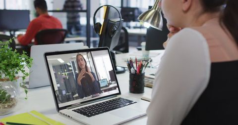 Woman Having Virtual Meeting with Colleague in Modern Office - Download Free Stock Images Pikwizard.com