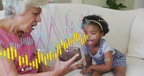 Grandmother Teaching Granddaughter Using Interactive Technology Charts