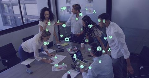 Collaborating team analyzing documents with digital network overlay for business strategy