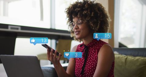 African American Woman Engaging with Social Media using Smartphone