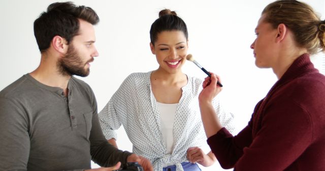 Female Model Smiling While Getting Makeup Done During Photoshoot - Download Free Stock Images Pikwizard.com