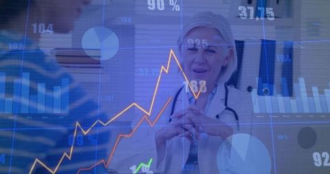 Female doctor consulting patient while interpreting clinical analytics and data dashboards
