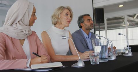 Diverse Professionals Engaged in Panel Discussion at Office Event - Download Free Stock Images Pikwizard.com