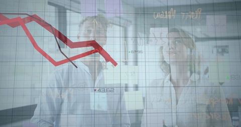 Businesswoman and Businessman Analyzing Financial Downturn