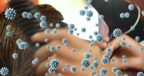 Hairdresser Working During Pandemic with Virus Overlay