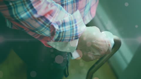 Elderly Person Holding Cane with Healthcare Overlays