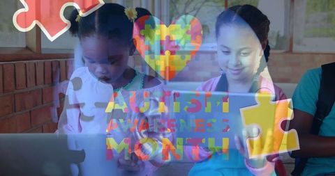 Children Collaborating on Laptops Highlight Autism Awareness