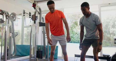 Focused strength training with weights in home gym setting