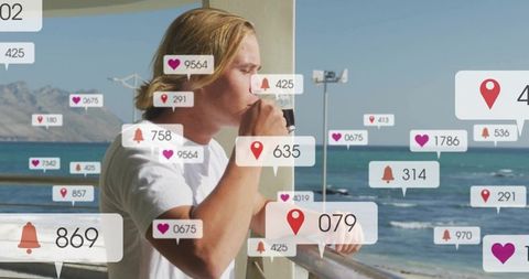 Young man drinking coffee on seaside balcony with social media notification overlays