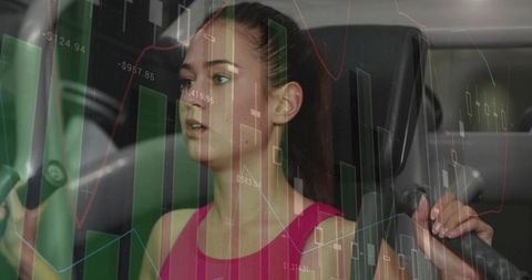 Young woman exercising on chest-press machine with stock market data overlay showing focus