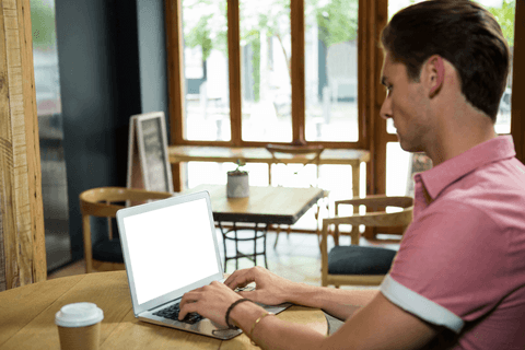 man using transparent laptop in modern cafe setting - Download Free Stock Videos Pikwizard.com