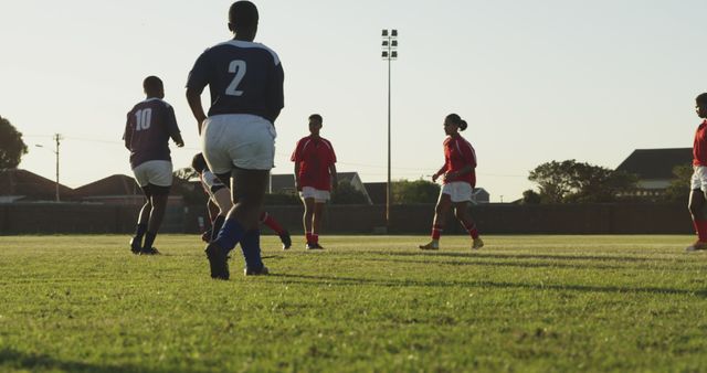 Teams Playing Soccer on Field at Sunset - Download Free Stock Images Pikwizard.com