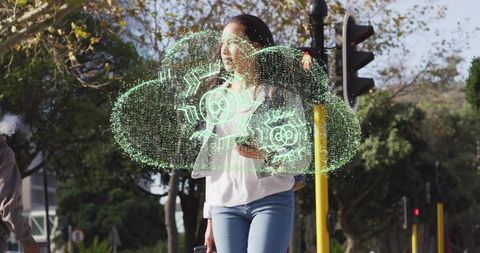 Woman with smartphone viewing holographic cloud in urban setting