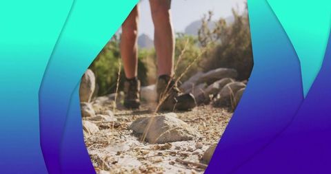 Hiker Boots Trekking Rocky Trail in Arid Landscape