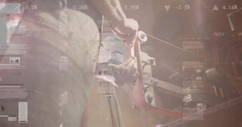 Metalworker using Belt Sander with Financial Data Overlays