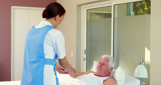 Nurse Caring for Elderly Man in Home Care Setting - Download Free Stock Images Pikwizard.com