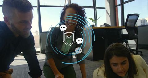 Collaborating team reviewing plan with secure messaging overlay in modern office workspace