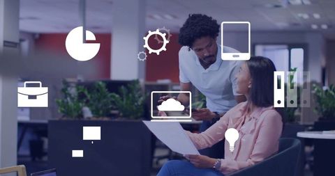 Collaborating colleagues reviewing cloud dashboard and analytics in modern open office