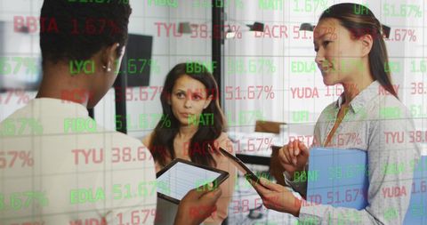Stock market data overlaid on diverse business meeting in office