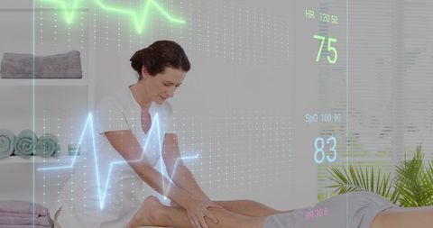 Physiotherapist treats patient with innovative health monitoring