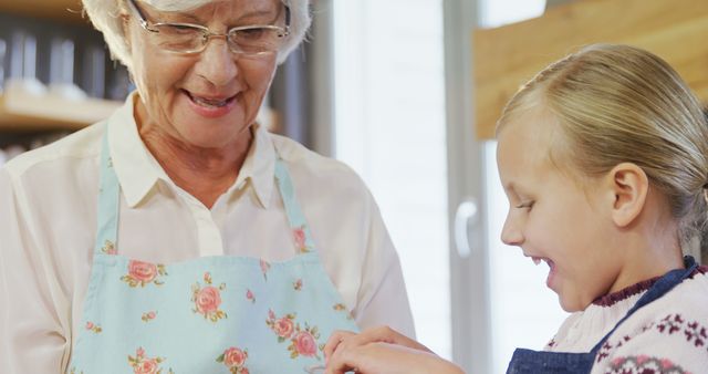 Grandmother Sharing Cooking Tips with Granddaughter in Kitchen - Download Free Stock Images Pikwizard.com