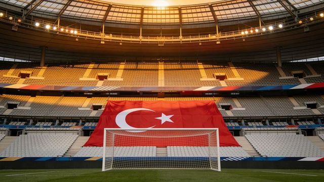 Stadium welcoming turkish flag draping grandstand behind football goal at golden sunset