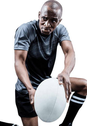 Determined african american rugby player holding ball on transparent background