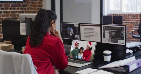Businesswoman Participating in Holiday Video Call with Family