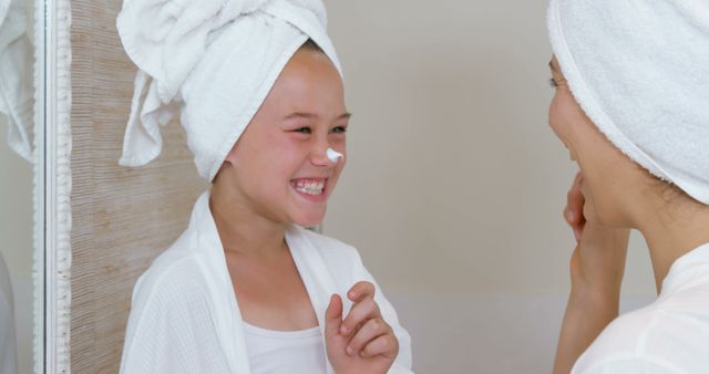 Mother and Daughter Sharing Skincare Routine in Bathroom - Download Free Stock Images Pikwizard.com