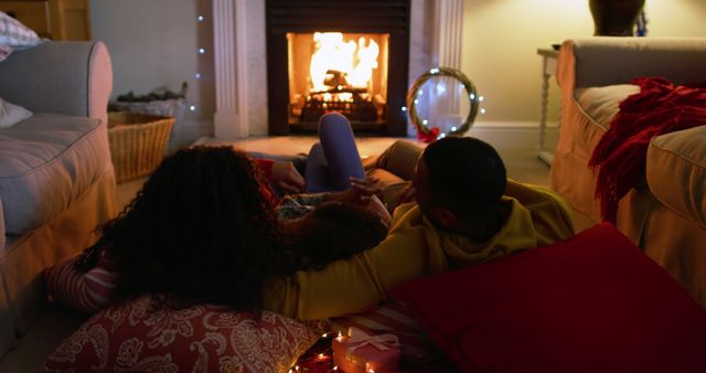 Family Relaxing by Fireplace During Holiday Season - Download Free Stock Images Pikwizard.com