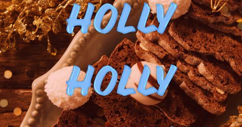 Festive Christmas Holly Text over Seasonal Decorations