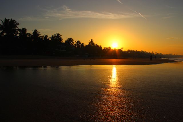 Brilliant Sunset Over Tranquil Beach Waters - Download Free Stock Photos Pikwizard.com