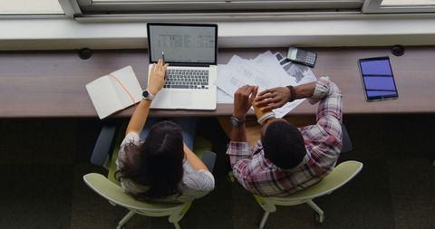 High Angle View of Diverse Professionals Collaborating at Workspace