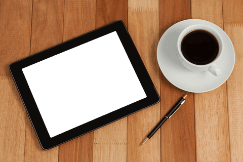 transparent digital tablet on wooden surface with coffee and pen - Download Free Stock Videos Pikwizard.com
