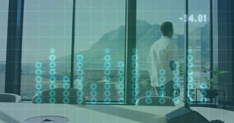 Businessman Overlooking City with Digital Data Overlay in Modern Office