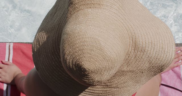 Woman Relaxing by the Pool Wearing Beach Hat Enjoying Summer Sun - Download Free Stock Images Pikwizard.com