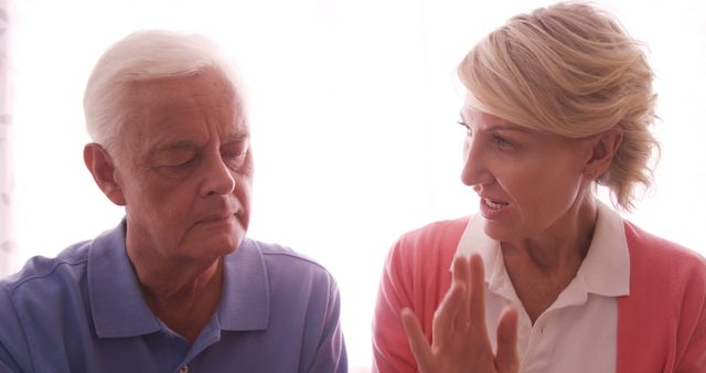 Senior man listening to concerned woman in discussion - Download Free Stock Images Pikwizard.com