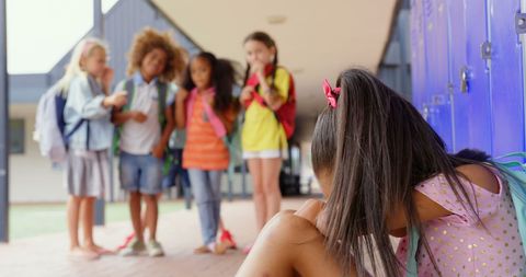 Schoolchildren Bullying Sad Girl in Corridor - Download Free Stock Images Pikwizard.com
