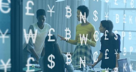 Businesswomen Discussing Global Currency Trends in Modern Office