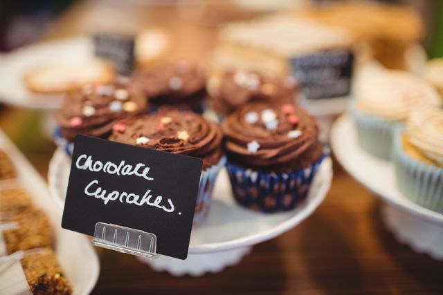 Close-up of chocolate cupcakes at counter in cake shop
