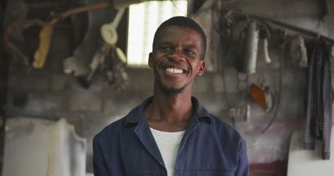 Smiling Mechanic in Rustic Workshop - Download Free Stock Images Pikwizard.com