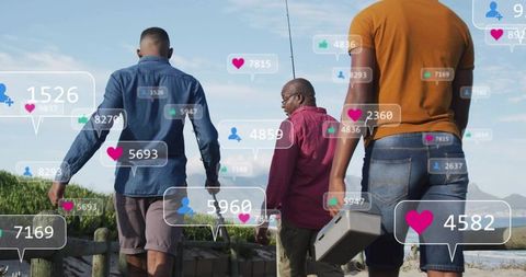 Walking to beach for fishing with friends carrying tackle and social media engagement