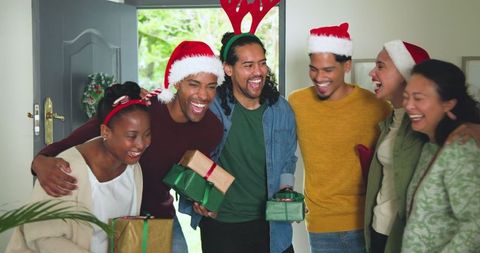 Diverse Friends Celebrating Holidays with Gifts and Laughter