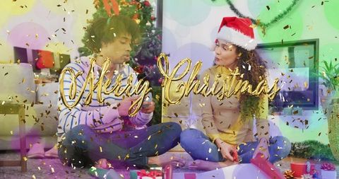Cozy couple wrapping christmas gifts and celebrating holiday cheer with santa hat and tree