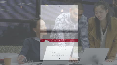 Business Team Analyzing Data on Laptop in Modern Office