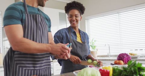 Happy Diverse Couple Cooking Healthy Meal Together